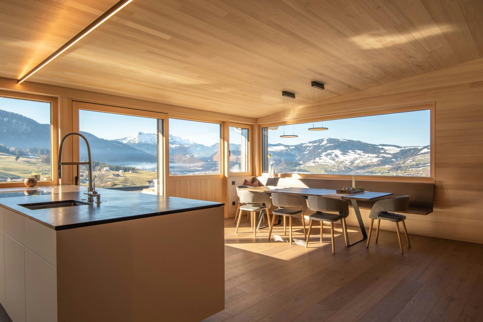 Modern mountain home kitchen with panoramic mountain views